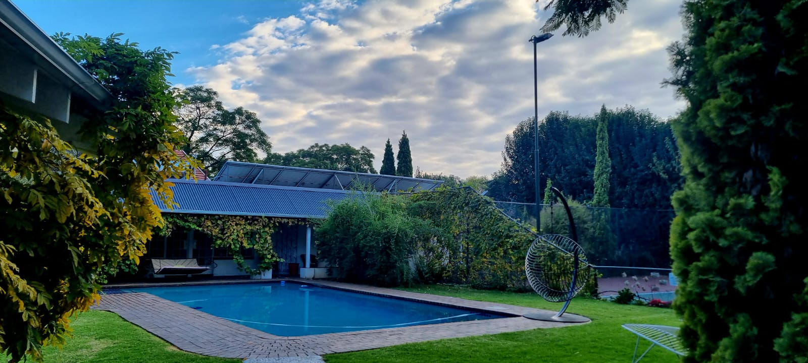 Wisteria-draped pool house